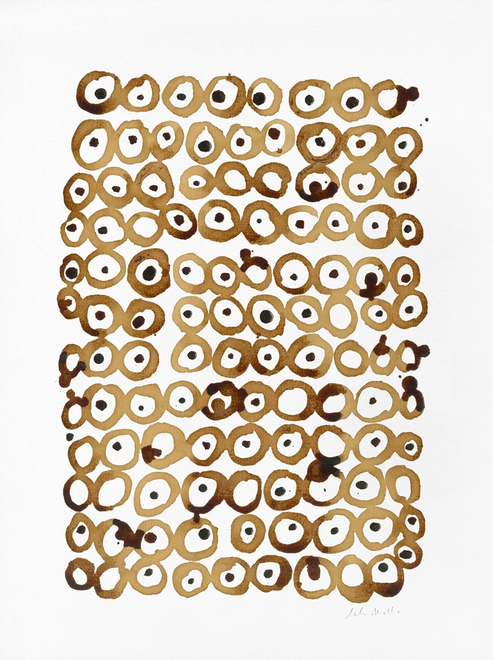Création graphique au café composée de motifs circulaires abstraits sur papier